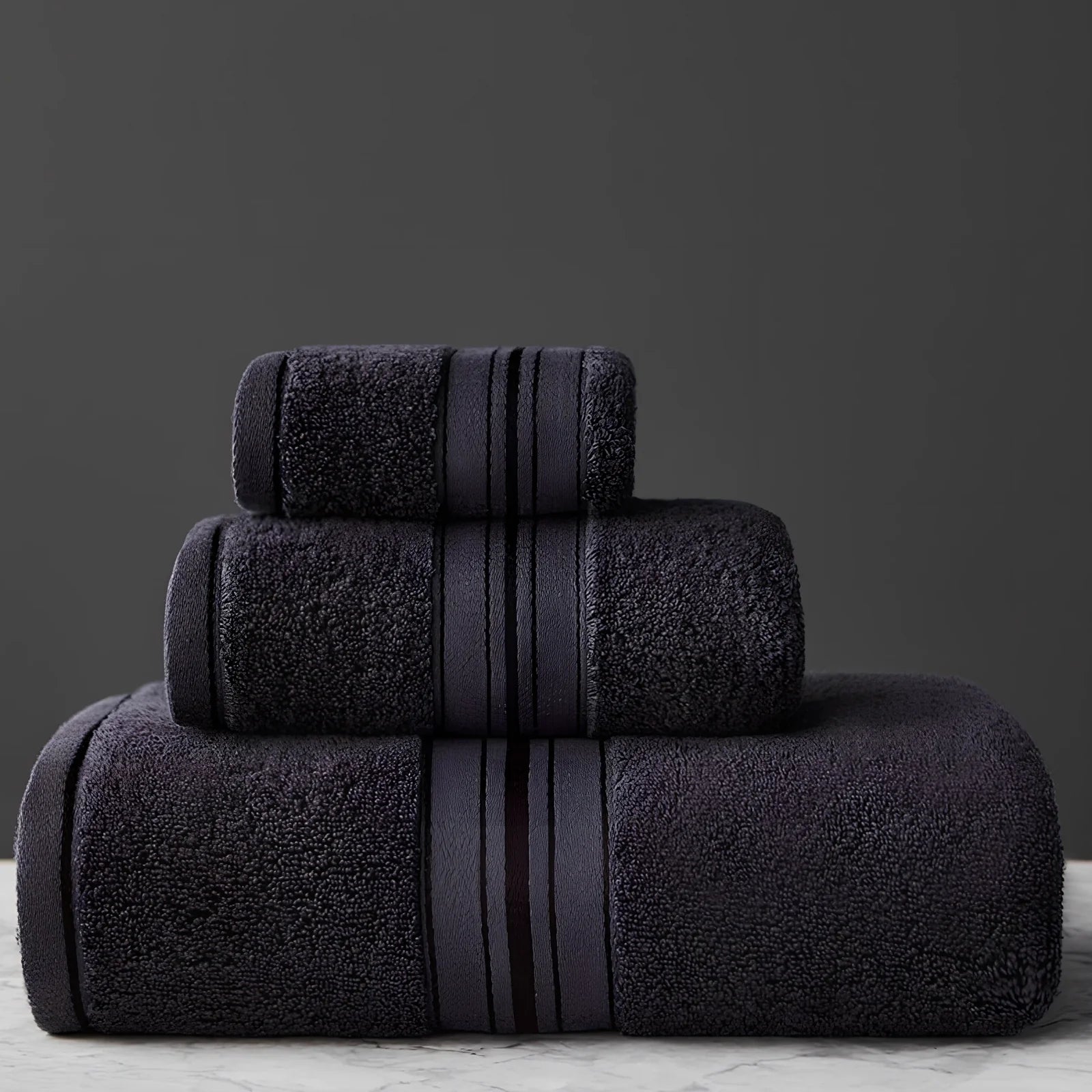 Three-piece cotton bath towel set in blue, featuring 70x150cm bath towel, 34x75cm hand towel, and 34x35cm square scarf for absorbent drying