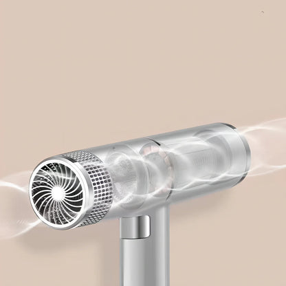 Compact silver hair dryer with nozzle attached showing measurements and power specifications