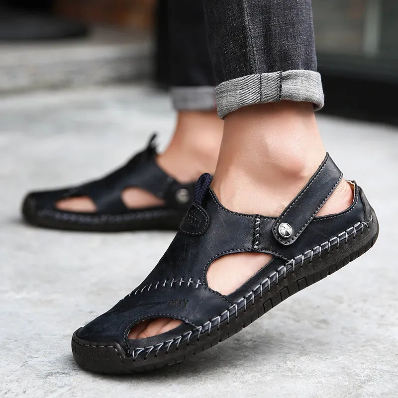 Men's closed toe sandals in black with rubber sole and adjustable slide strap