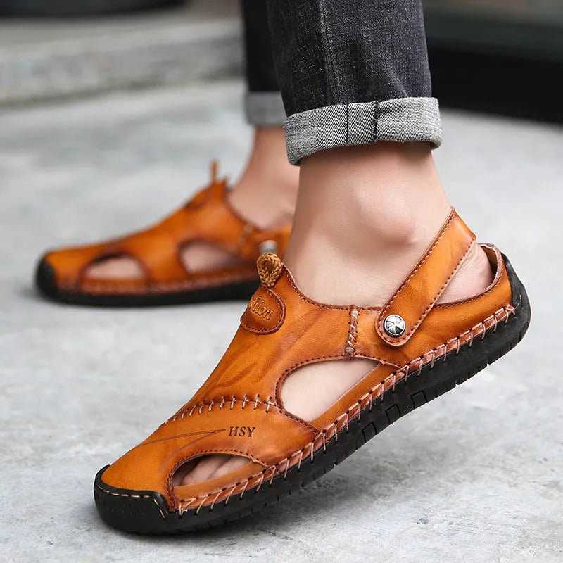 Men's closed toe sandals in black with rubber sole and adjustable slide strap