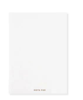 Soft red imitation leather notebook with bronzing detail, open to show dot grid inner pages.