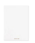 Soft red imitation leather notebook with bronzing detail, open to show dot grid inner pages.