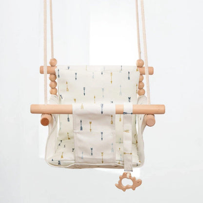 Bohemian style baby swing chair with wooden seat and cotton rope, perfect for indoor and outdoor use.