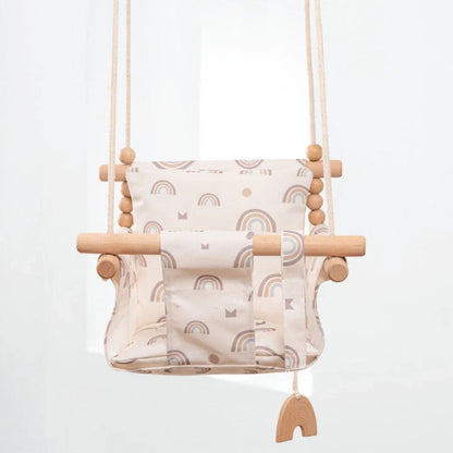 Bohemian style baby swing chair with wooden seat and cotton rope, perfect for indoor and outdoor use.