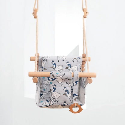 Bohemian style baby swing chair with wooden seat and cotton rope, perfect for indoor and outdoor use.