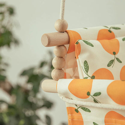 Bohemian style baby swing chair with wooden seat and cotton rope, perfect for indoor and outdoor use.