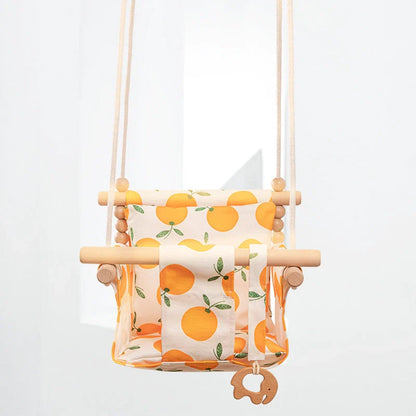 Bohemian style baby swing chair with wooden seat and cotton rope, perfect for indoor and outdoor use.