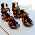 Pair of printed suede dog shoes in green with non-slip sole for medium and large dogs on a white background