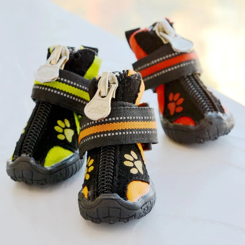 Pair of printed suede dog shoes in green with non-slip sole for medium and large dogs on a white background