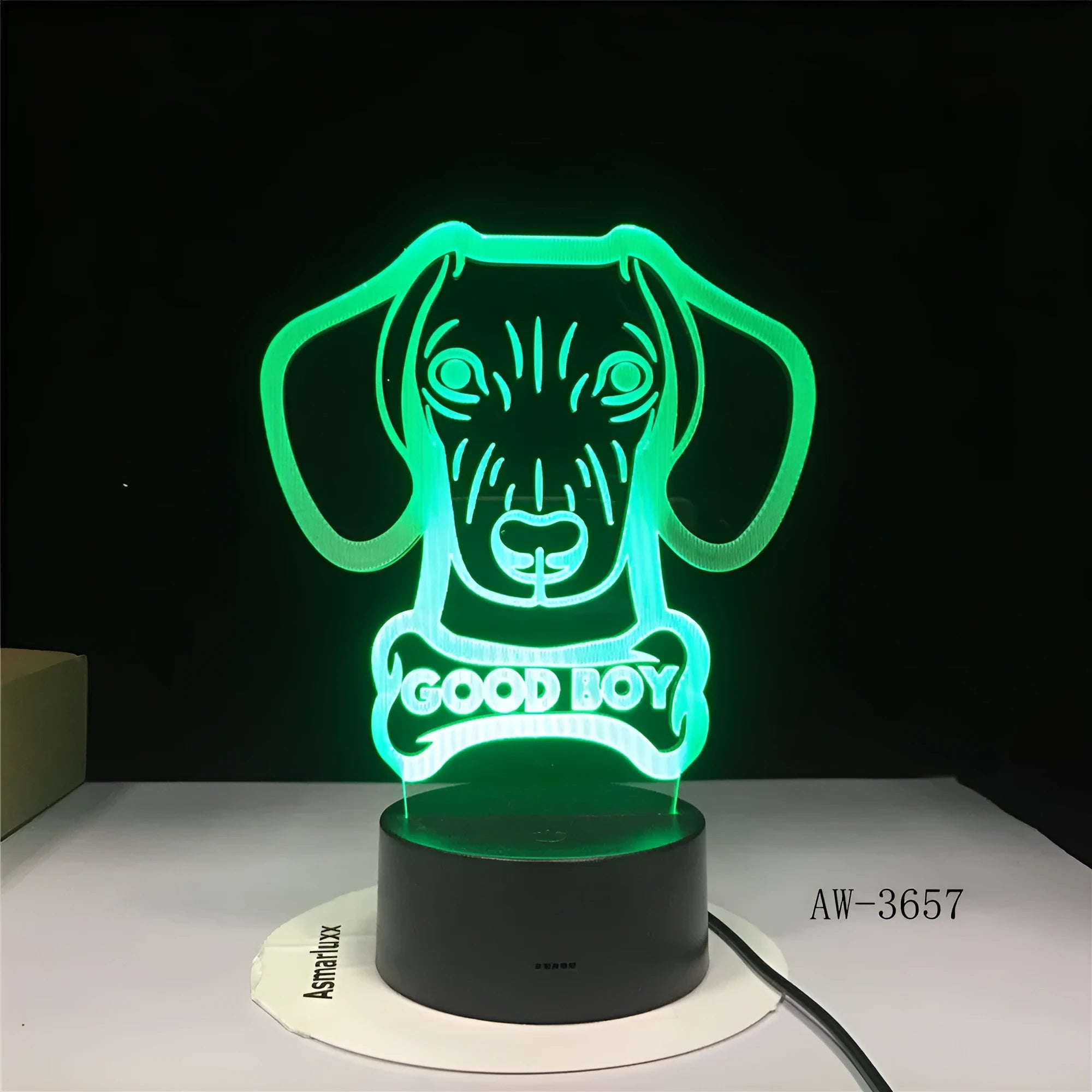A colourful gradient LED table lamp with a tall acrylic shade on a black base, featuring a remote control.