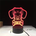 A colourful gradient LED table lamp with a tall acrylic shade on a black base, featuring a remote control.