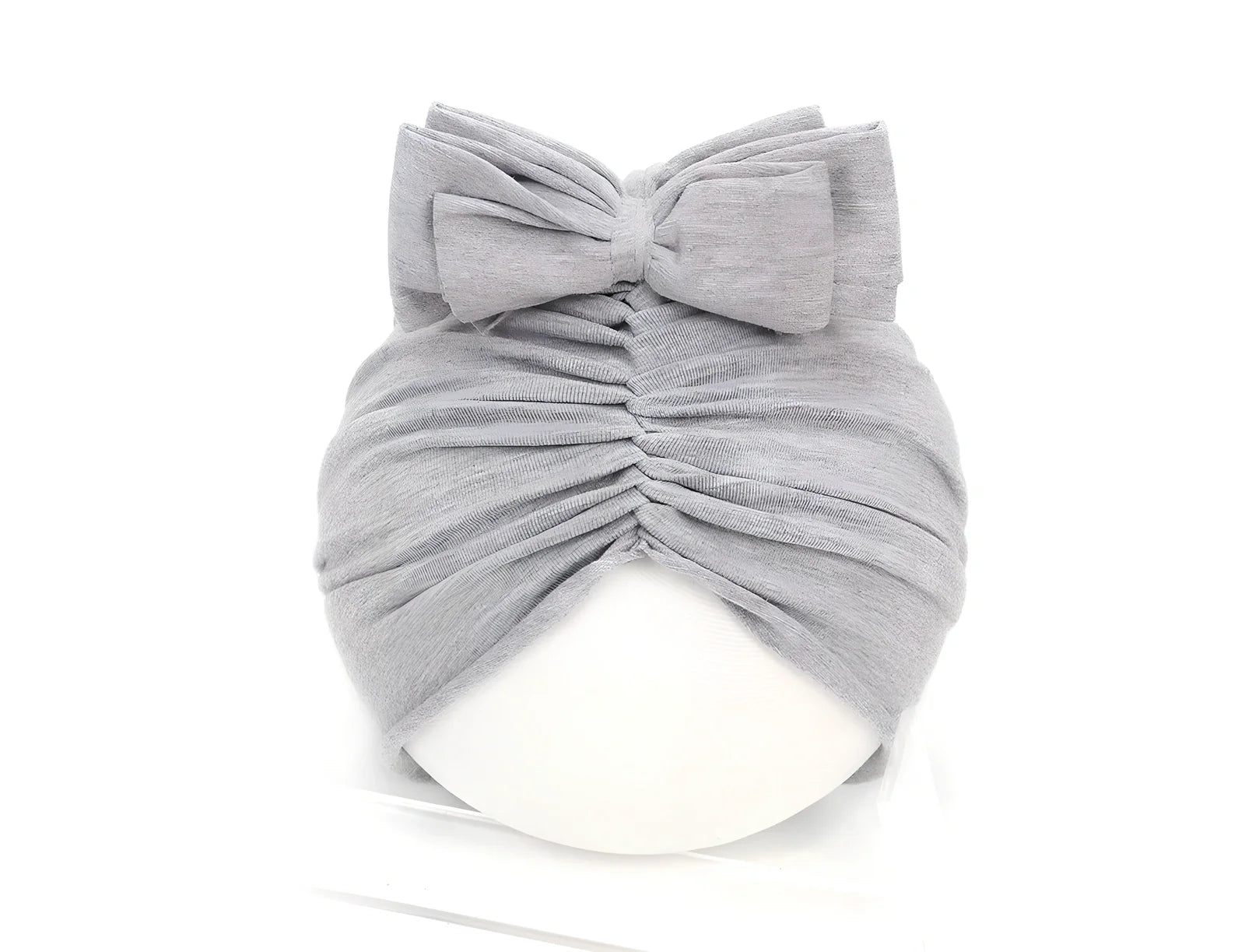 Soft knitted acrylic baby hat in various colours with stretch fit for infants 0-28 months