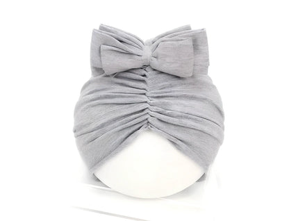 Soft knitted acrylic baby hat in various colours with stretch fit for infants 0-28 months