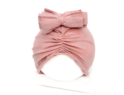 Soft knitted acrylic baby hat in various colours with stretch fit for infants 0-28 months