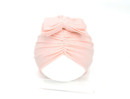 Soft knitted acrylic baby hat in various colours with stretch fit for infants 0-28 months