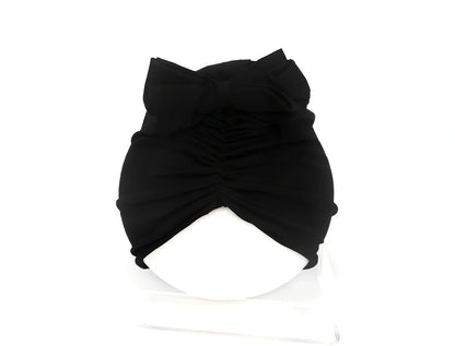 Soft knitted acrylic baby hat in various colours with stretch fit for infants 0-28 months