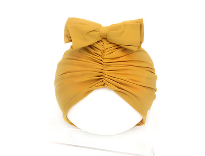 Soft knitted acrylic baby hat in various colours with stretch fit for infants 0-28 months