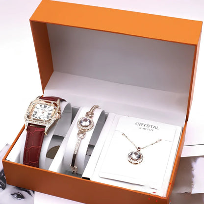 Women's black leather wrist watch set with 32mm dial, necklace, and bracelet on display