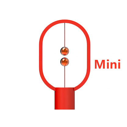 Magnetic bedside night light with ball activation system and adjustable brightness settings