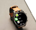 Black smartwatch with 1.6-inch screen, dual cameras, and a wrist strap showing 4G connectivity and heart rate monitoring
