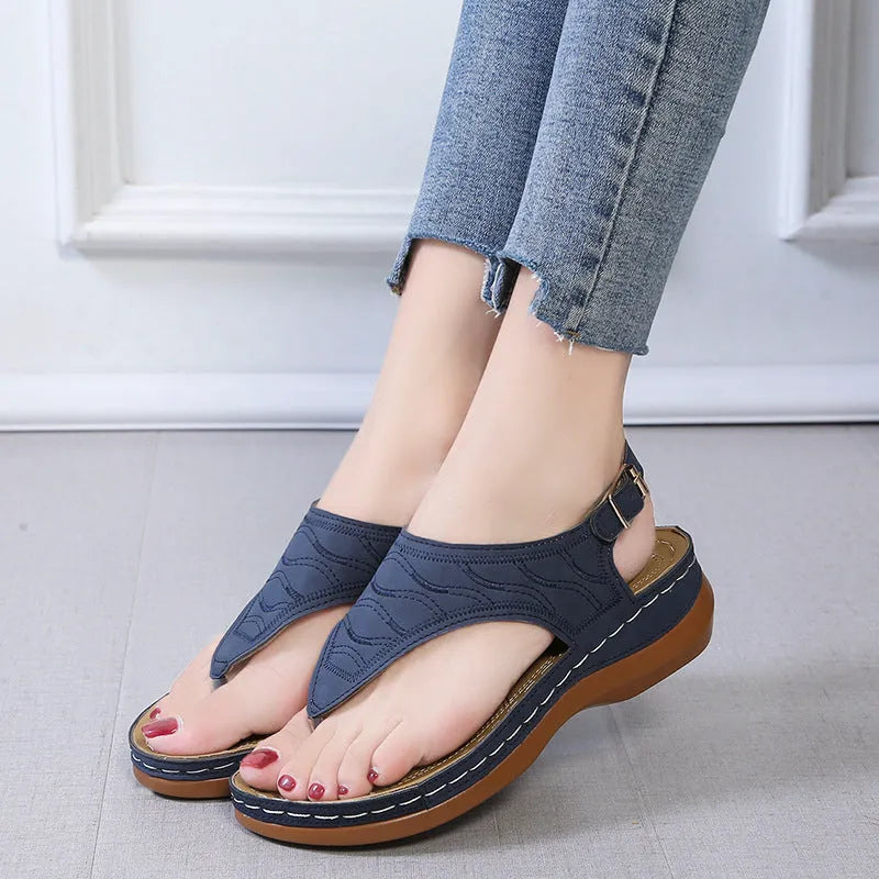 Women's casual wedge heel flip flop sandals with adjustable back strap in red, green, black, blue, and khaki