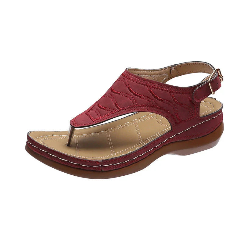 Women's wedge heel flip flop sandals in red with adjustable strap