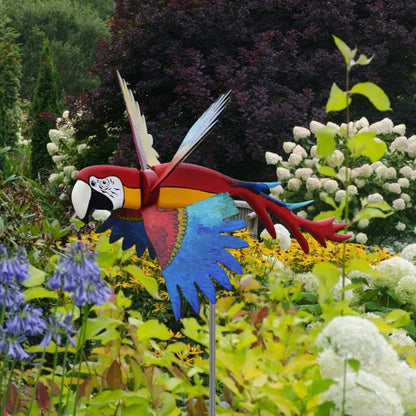 Parrot-themed garden windmill decoration with vibrant colours, spinning in the breeze