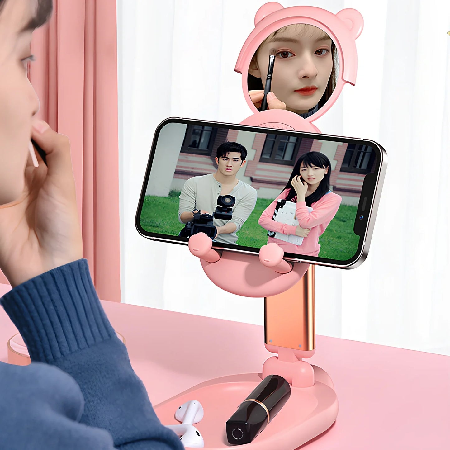 Adjustable desk phone stand with mirror holding iPad, showing 360-degree rotation capability