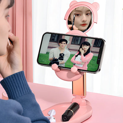 Adjustable desk phone stand with mirror holding iPad, showing 360-degree rotation capability