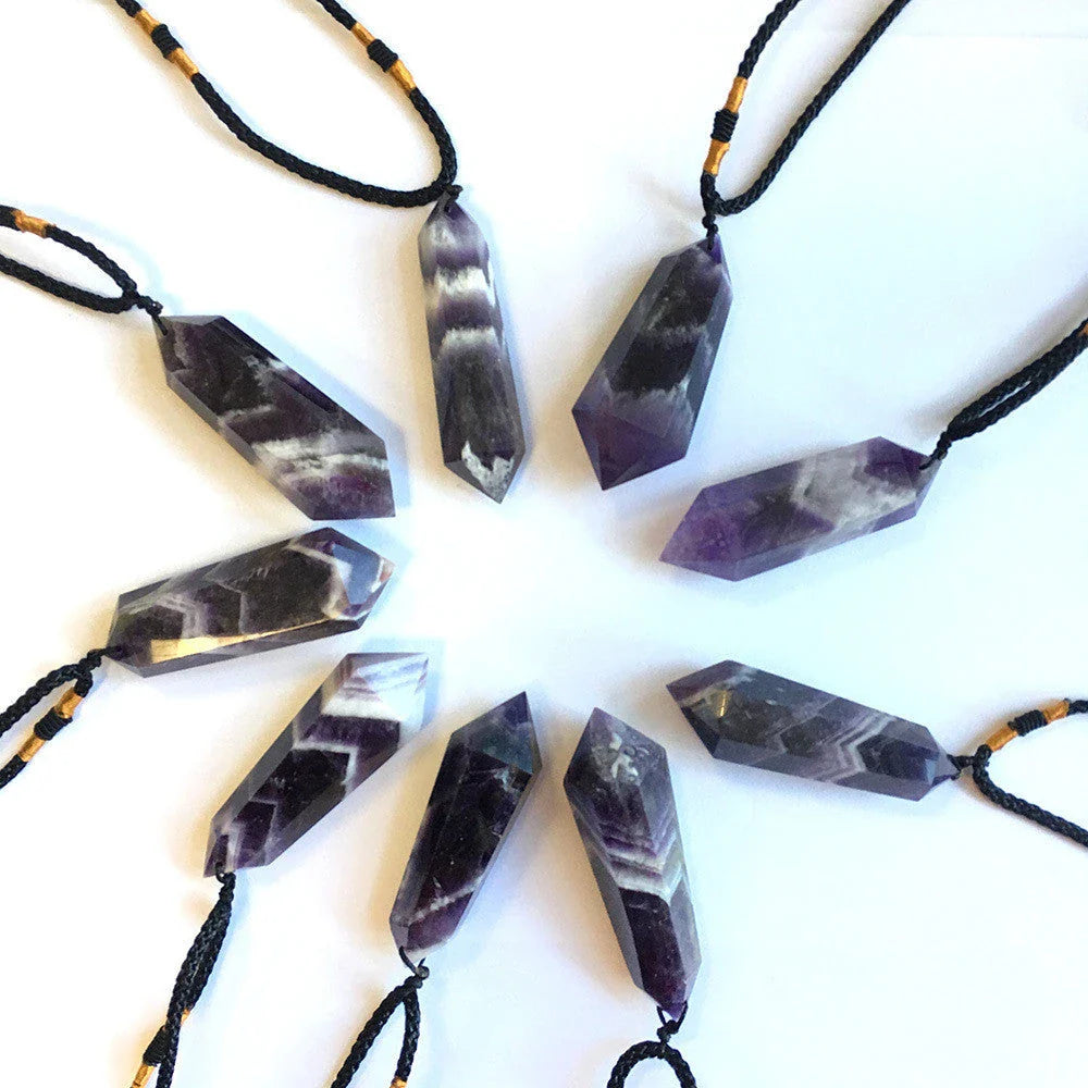 Handcrafted natural amethyst double-pointed crystal pendant with unique geometric design