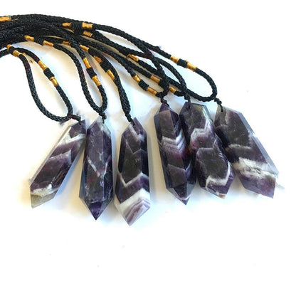 Handcrafted natural amethyst double-pointed crystal pendant with unique geometric design