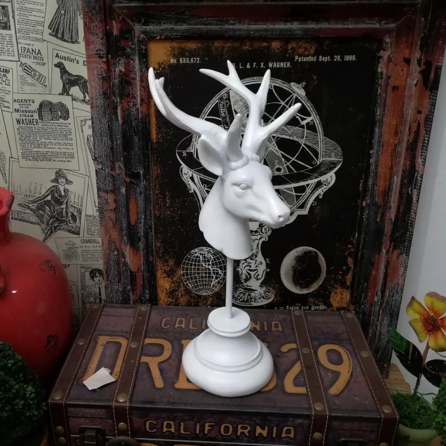 Natural resin animal sculpture home decoration in black, white, and wood colour finishes, dimensions 13cm by 15cm by 32cm.