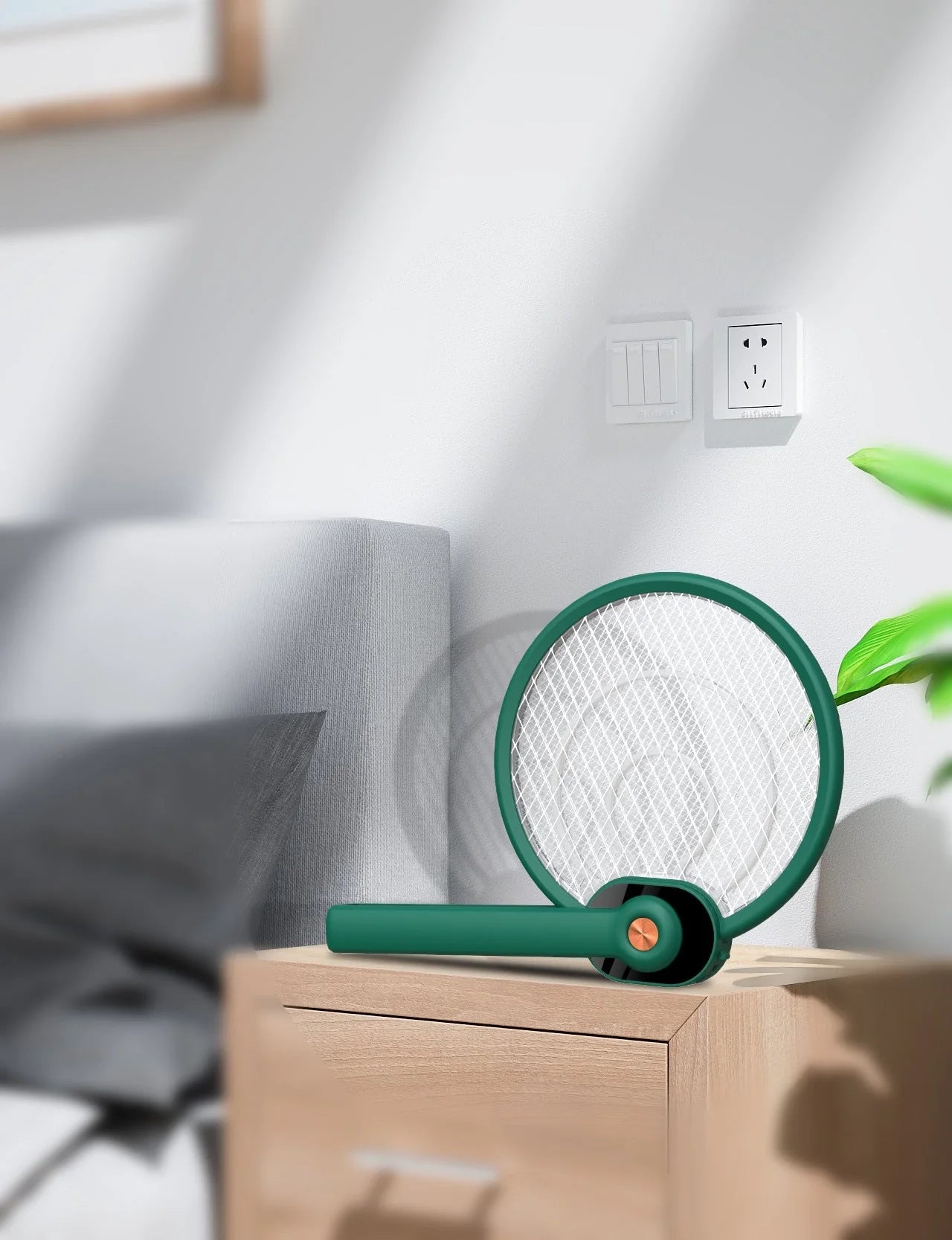 Dual-mode electric mosquito swatter in green and blue, foldable design with USB charging