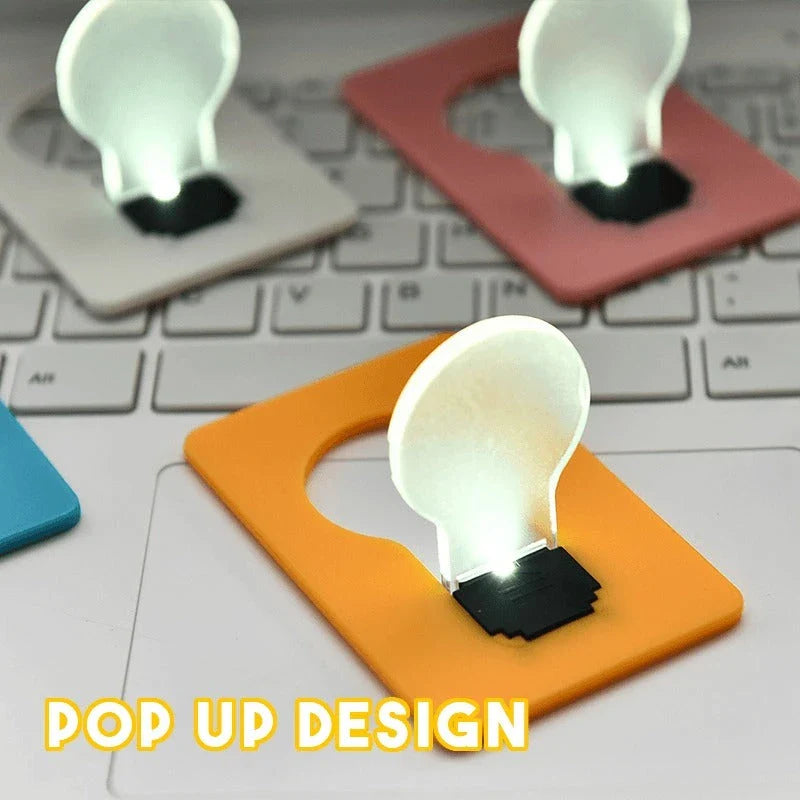 Credit card-sized foldable LED pocket lamp with acrylic shade and inductive switch