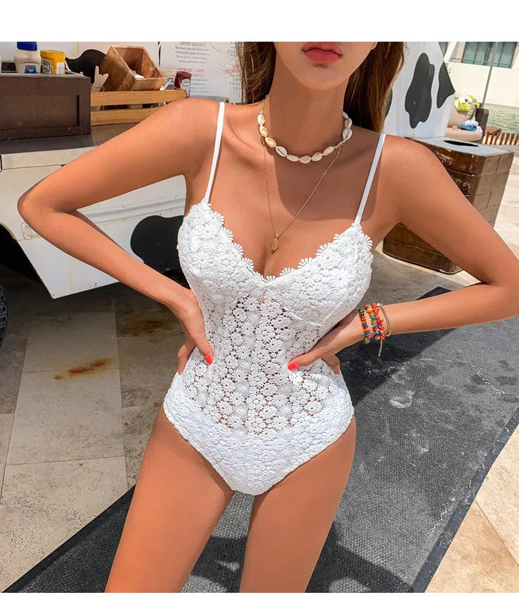 Women's white embroidered knitted one-piece swimsuit with chest pad, tight fit, shown on model.