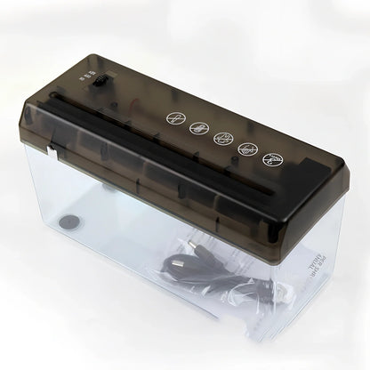 Small electric A4 strip cut paper shredder on desk, 29cm x 15cm x 19cm, shreds 5 sheets into 6mm pieces