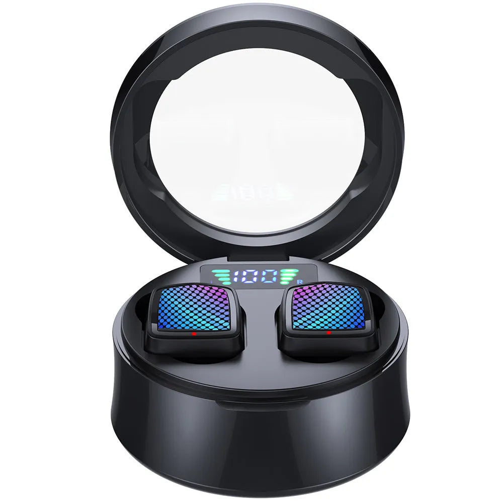 Black and white true wireless Bluetooth earbuds with a compact charging case on a table.