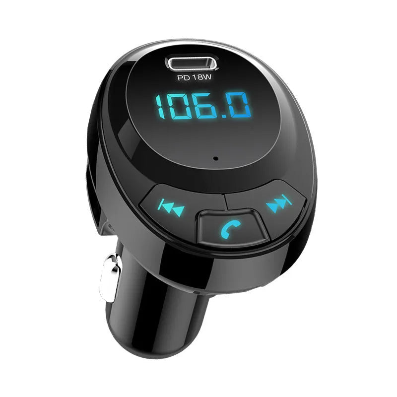 Black Bluetooth car MP3 player with digital screen and dual USB ports plugged into a car cigarette lighter.
