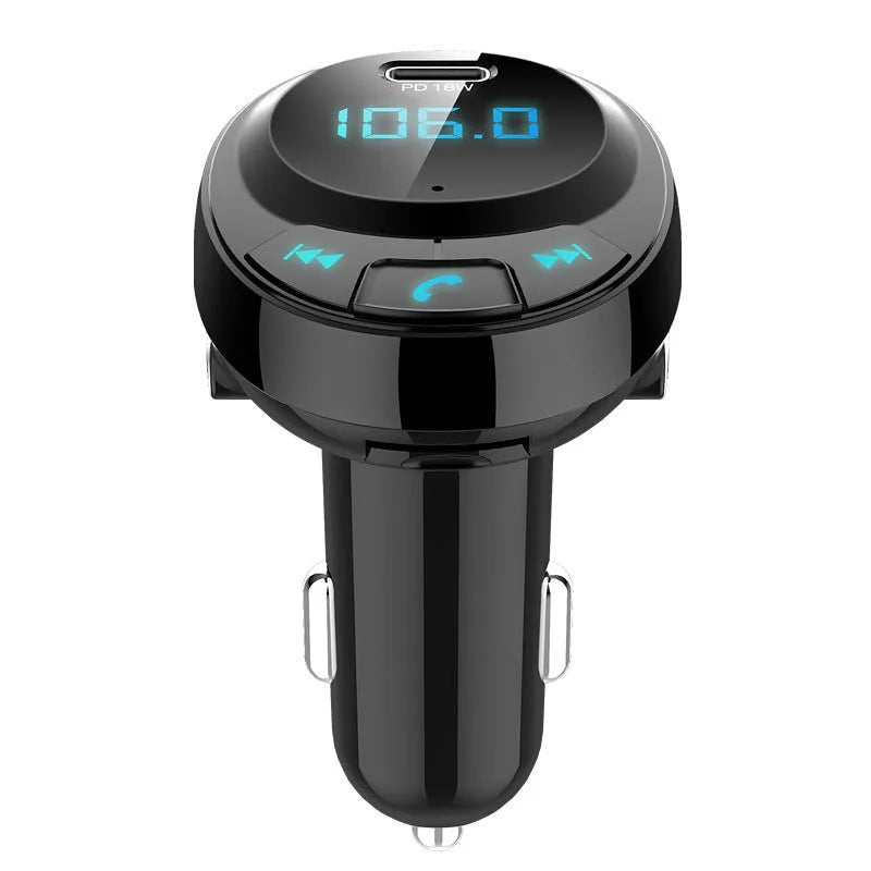 Black Bluetooth car MP3 player with digital screen and dual USB ports plugged into a car cigarette lighter.