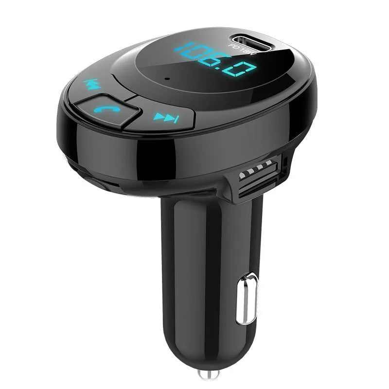 Black Bluetooth car MP3 player with digital screen and dual USB ports plugged into a car cigarette lighter.