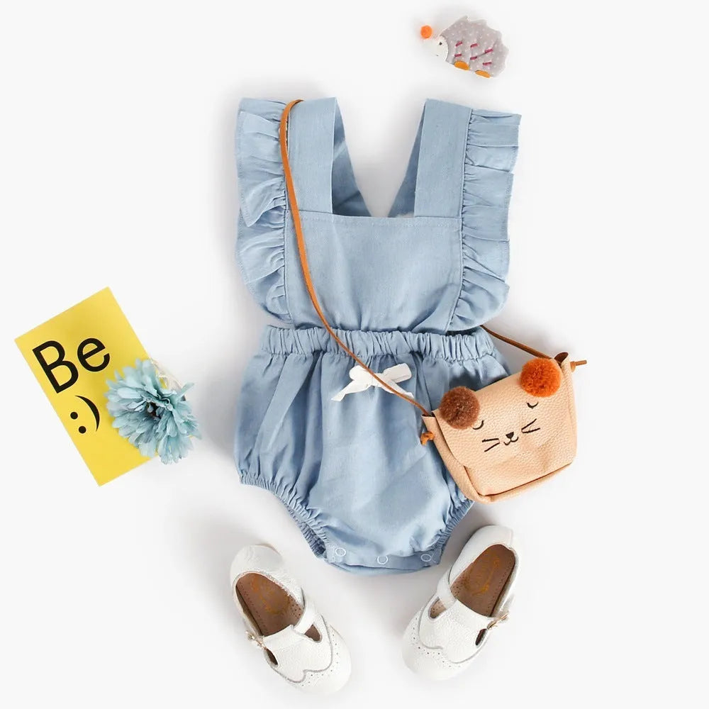 Blue denim lace sleeveless baby romper on a hanger, showing the triangle crawl leg design.