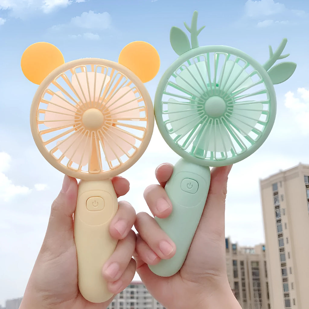 Hand-held mini fan with plastic blades in blue, green, pink or yellow cartoon design with USB charging port
