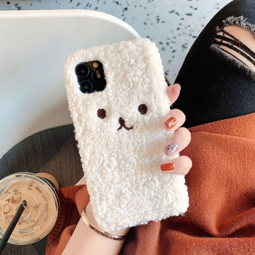 Brown embroidered plush bear face design on a flexible TPU phone case for Apple iPhone.