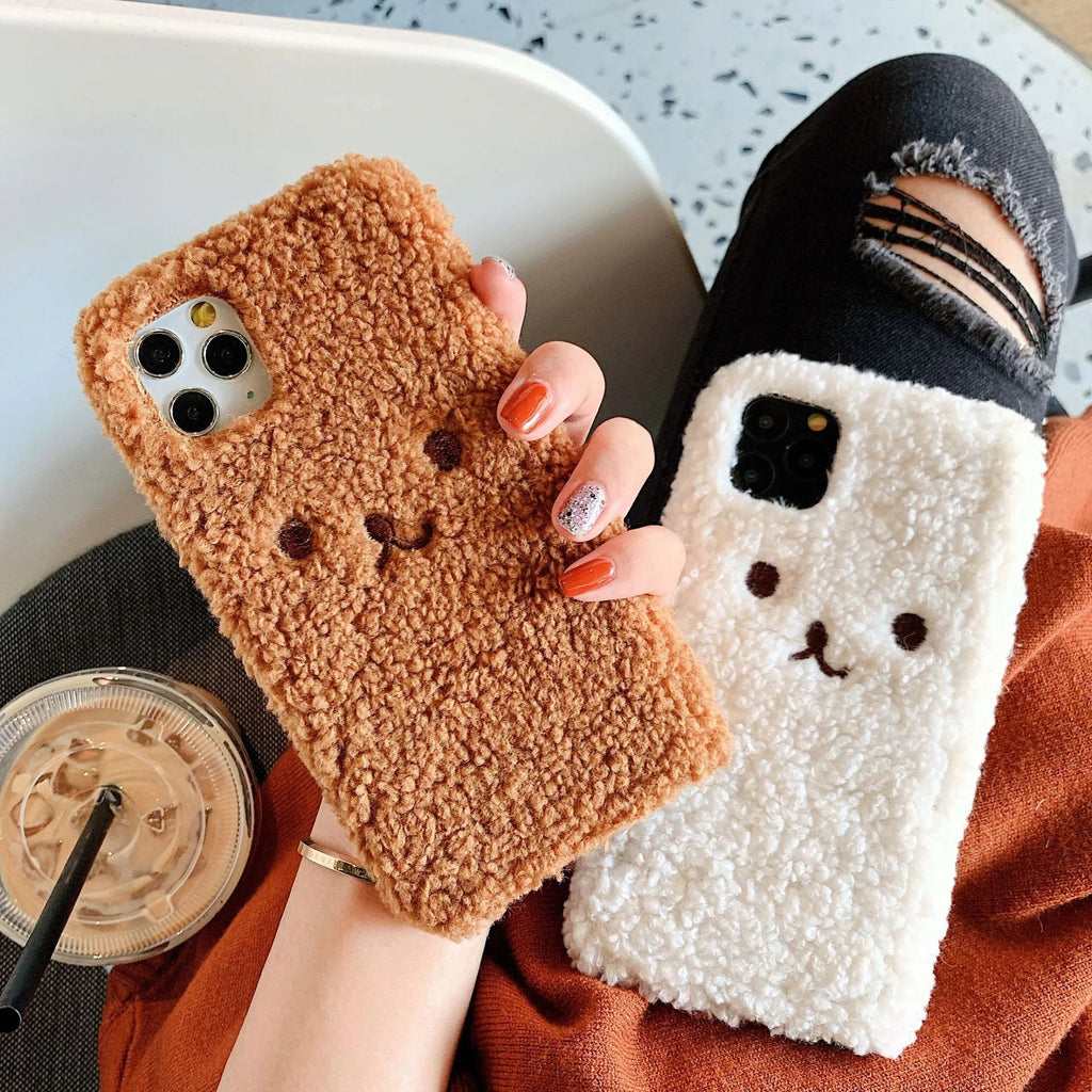 Brown embroidered plush bear face design on a flexible TPU phone case for Apple iPhone.