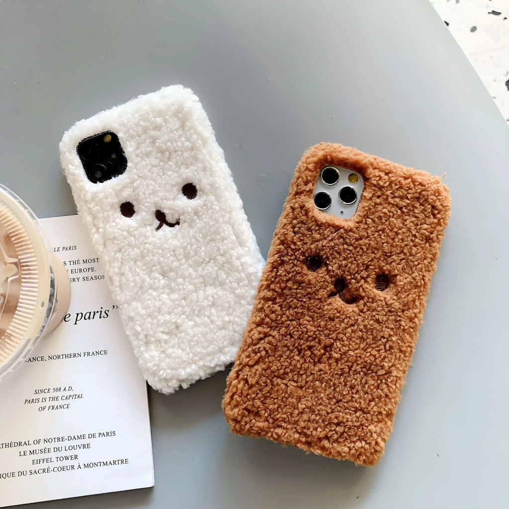 Brown embroidered plush bear face design on a flexible TPU phone case for Apple iPhone.