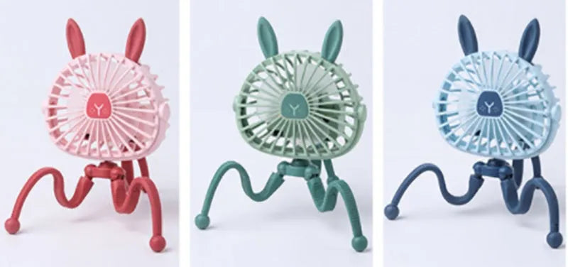 Cute animal design mini stroller fan with LED night light and flexible clip in pink on a stroller