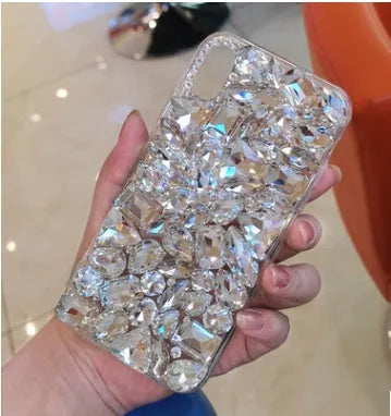 Clear rhinestone decorative iPhone case showing TPU construction with crystal gem elements