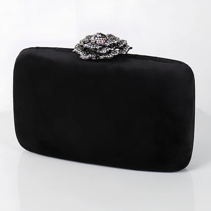 Suede diamond evening clutch bag in black with 17.5cm width, chain strap, and compact 13.8x5cm design for parties