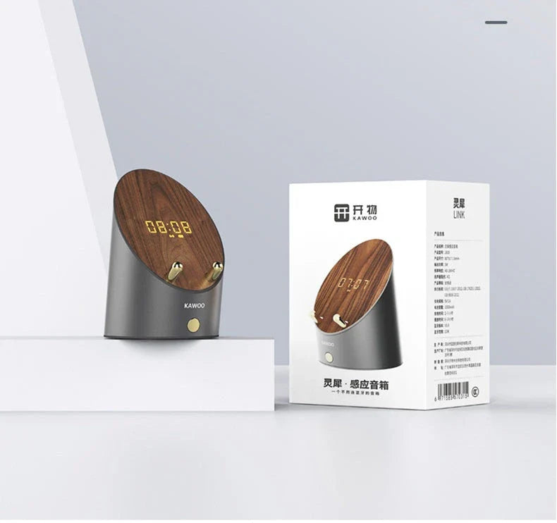 Sleek wooden wireless speaker with induction charging, digital alarm clock, and Bluetooth 5.0 connectivity