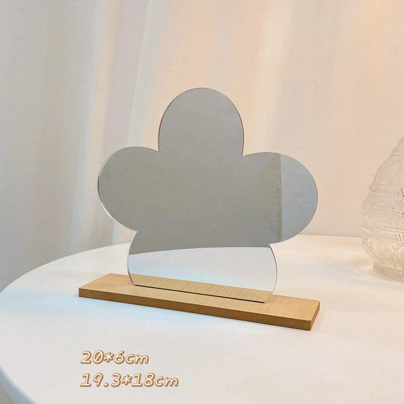 Irregular shaped acrylic makeup mirror with a wooden base, available in various whimsical designs such as cactus, bears, flowers, and more